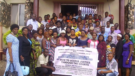 Miriam Menkiti (Mrs.), executive director, Women Information Network (WINET) (1st left on front roll) in a group photograph with the deaf during the workshop for them held in Enugu recently.